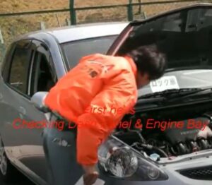 inspecting Engine of used car